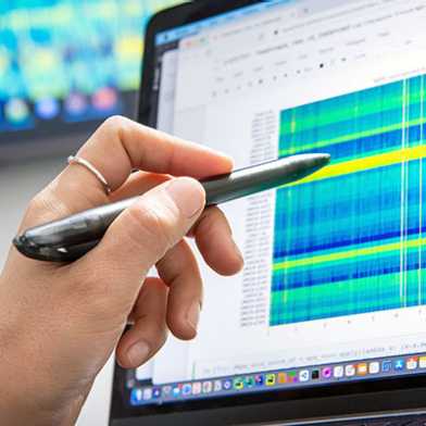Screen with blue, green and yellow stripes showing DNA sequencing results.